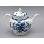 A First Period Worcester Teapot With Cover decorated in underglaze blue, crescent mark to base