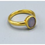 An 18ct. Yellow Gold Dress Ring set oval moon stone 5.8 gms. ring size P