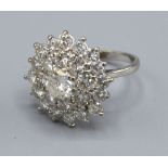 An 18ct White Gold Diamond Set Large Cluster Ring with large central diamond surrounded by