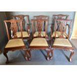 A Set Of Six Chippendale Style Mahogany Dining Chairs, each with a pierced carved back above a