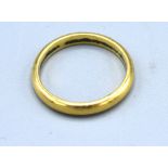 An 18ct. Gold Wedding Band 3.1 gms.