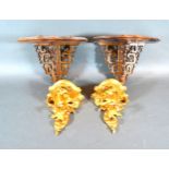 A Pair Of Small Gilded Wall Brackets together with a similar pair of mahogany wall brackets