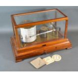 A Mahogany Cased Barograph By Negretti & Zambra, London with chart drawer together with a Negretti &