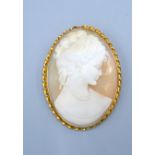 A Large Oval Cameo Brooch within 9ct. gold frame decorated in relief with a classical female 6 x 4.5
