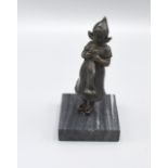 A Patinated Bronze Figure in the form of a Dutch Girl with variegated marble base 14cm tall