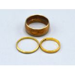 A 9ct. Gold Wedding Band 9.9 gms together with an 18ct. gold wedding band 1.6 gms and a 22ct. gold