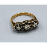 An 18ct. Gold Sapphire And Diamond Triple Cluster Ring claw set, 3.6 gms, ring size I