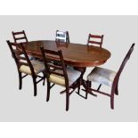 A 20th Century Dining Room Suite comprising extending dining table with extra leaf together with a