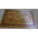 A North West Persian Woollen Rug with central medallion with an all over design upon a blue, red and