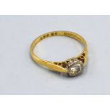An 18ct Yellow Gold Solitaire Diamond Ring size O, 2 gms.