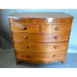 A 19th Century Mahogany Bow-Fronted Chest with two concealed drawers above two short and three