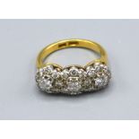 An 18ct Yellow Gold Triple Diamond Cluster Ring within a pierced setting, ring size P, 7.5 gms., the