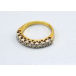 An 18ct Gold Half Eternity Ring set with nine diamonds within a pierced setting, ring size K, 3.3