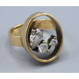 A 9ct Yellow Gold Dress Ring set three paste stones within a hoop, ring size P, 6.6 gms
