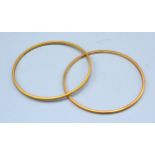 A Pair Of 22ct. Gold Bangles 22.5 gms.