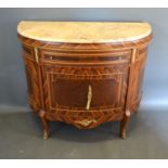 A French style demi-lune side cabinet, the variegated marble top above a frieze drawer with brass