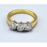 An 18ct. Yellow Gold Three Stone Diamond Ring set within a pierced setting, approximately 0.90 ct.