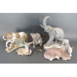 A Lladro Porcelain Model Of An Elephant With Calf together with four other Lladro porcelain models