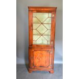 A Mahogany Standing Corner Cabinet together with a Victorian mahogany drawing room armchair