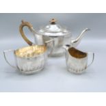 A Matched Three Piece Silver Tea Service comprising teapot, Sheffield 1897, and a matched two