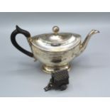 A Continental White Metal Teapot together with a continental white metal carriage