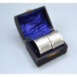 A Pair Of Birmingham Silver Napkin Rings with fitted case
