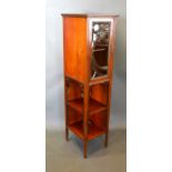 An Art Nouveau Mahogany Cabinet with a glazed door above two open shelves, 36cms wide, 40cms deep,