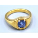 An 18ct. Gold Signet Ring set with a 2ct. pale blue Ceylon sapphire, claw set, 16.3 gms, ring size T