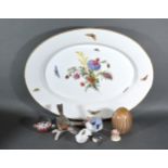 A Berlin Porcelain Oval Platter decorated butterflies amongst foliage together with a B&G model of a