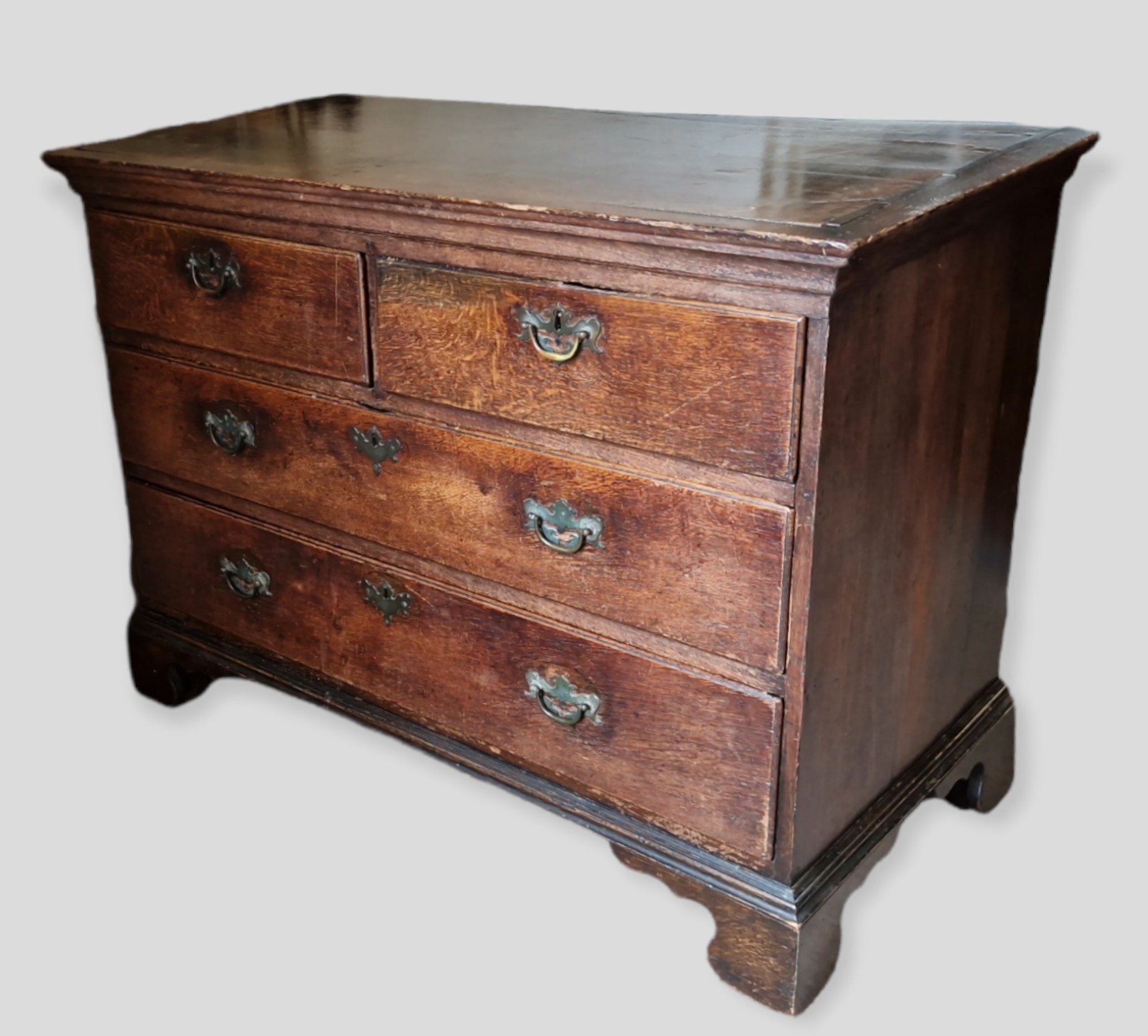 A 19th Century Oak Chest, the moulded top above two short and two long drawers with brass handles