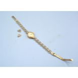 A 9ct. Gold Cased Ladies' Wrist Watch with 9ct. bracelet, 6gms excluding movement