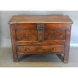 A George III Oak Mule Chest, the hinged top above a two panel front and a long drawer flanked by