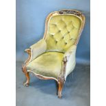 A Victorian Walnut Drawing Room Armchair, the button upholstered back above a stuff over seat raised
