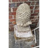 A Weathered Concrete Finial in the form of a Pineapple upon a square plinth