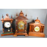 A Victorian Mantle Clock, the silvered dial with Arabic numerals and two train movement, 56cms