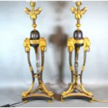 A Pair Of French Patinated Bronze And Gilt Metal Mounted Table Lamps each of tri-form with lion mask