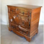 A 17th Century Oak Chest, the moulded top above three geometrically moulded drawers with metal