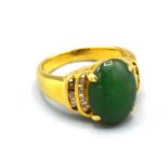 An 18ct. Gold Diamond And Jade Set Dress Ring, 6.6gms. ring size K