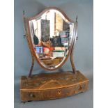 A 19th Century Sheraton Revival Swing Frame Toilet Mirror, the shield shaped mirror above a three