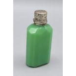 A White Metal Mounted Green Glass Scent Bottle with Stopper, 8cms tall