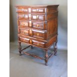 A 17th Century Oak Chest On Stand with five geometrically moulded drawers with brass drop handles