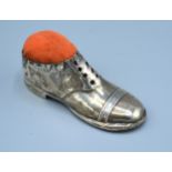 An Edwardian Silver Pin Cushion in the form of a shoe, Birmingham 1910, 12cms long