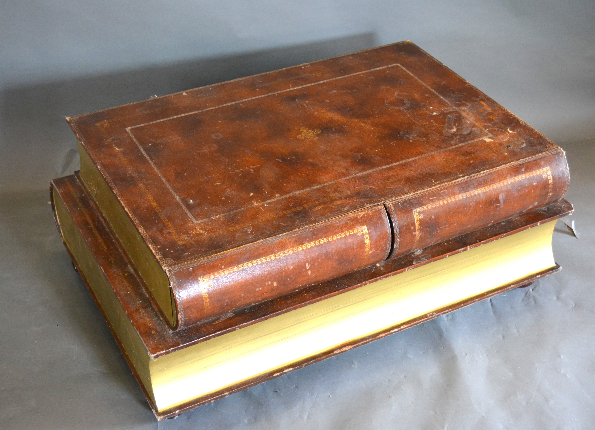 A 20th Century Coffee Table in the form of two books with two frieze drawers, 102 x 65 cms, 43cms