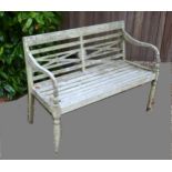 A Teak Garden Bench in the Regency style with a slatted back and turned front supports, 120cms wide