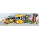 A Cast Iron Money Box 'Punch and Judy' together with another 'Jonah and the Whale' and another