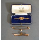 A 9ct. Gold Bar Brooch in the form of a Crown together with another bar brooch set single pearl