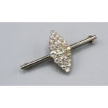 A White Metal Brooch set with diamonds and of marquis form, 2.3 x 1 cms