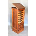 An Edwardian Mahogany Clerks Desk/Filing Cabinet with a hinged top above a tabour front enclosing