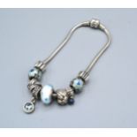 A Bracelet by Pandora set various charms