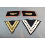 Two ORGL SS Chevrons together with a pair of German collar patches